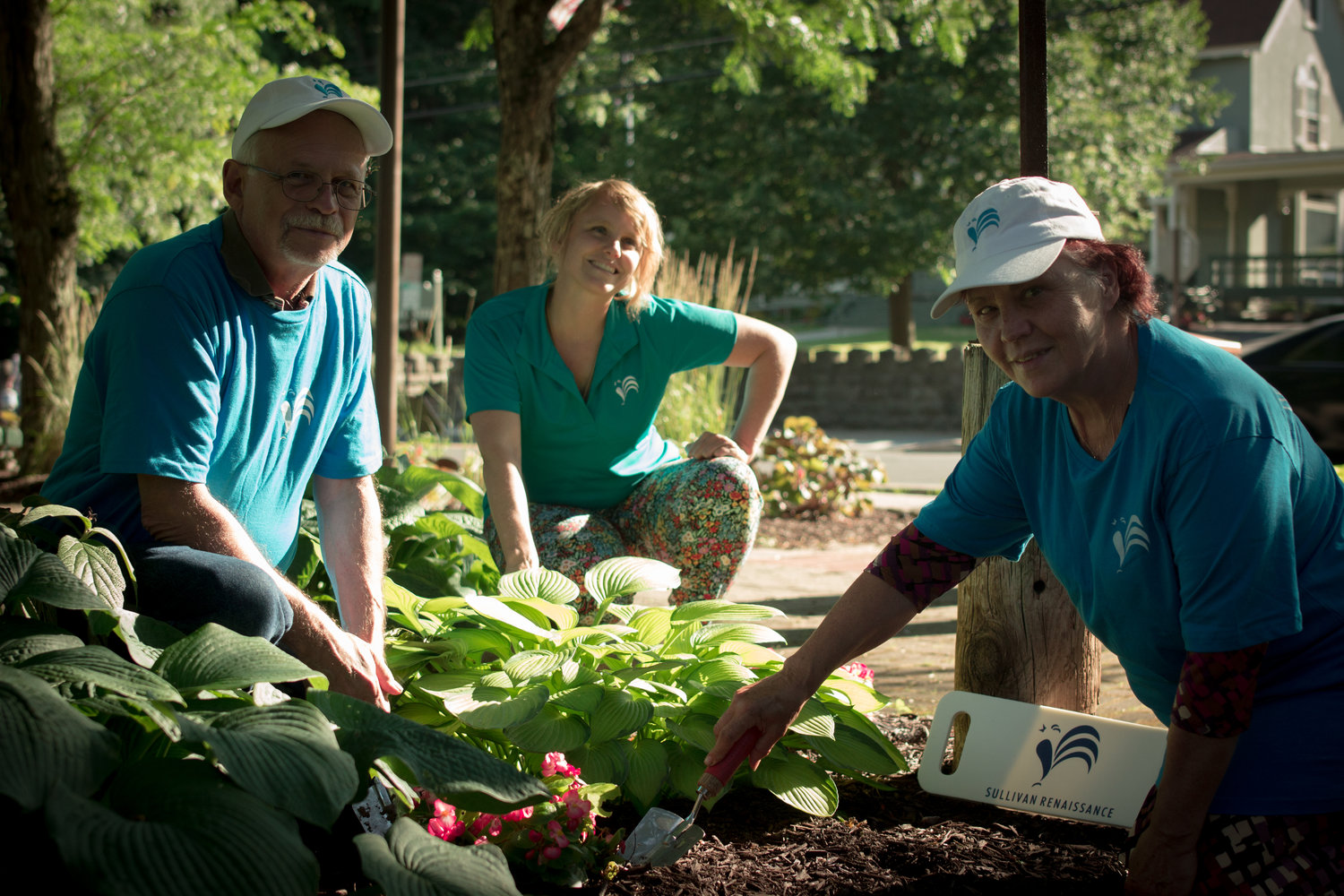Volunteer Corps Members Frank Ulbrichm, left, Maggie Tuttle Schutte and Yolanda Suida at Lapolt Park in Liberty.